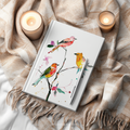 Colorful songbirds on a branch on a matte hardcover journal whimsical animal home decor by WhisperWillow Studios gift