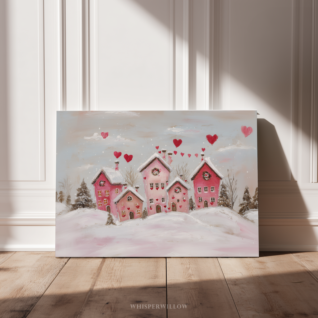 Verspieltes rosa Winterdorf auf Leinwand | Romantisches Herzmotiv mit verschneiten Häusern | Wandbild zum Valentinstag